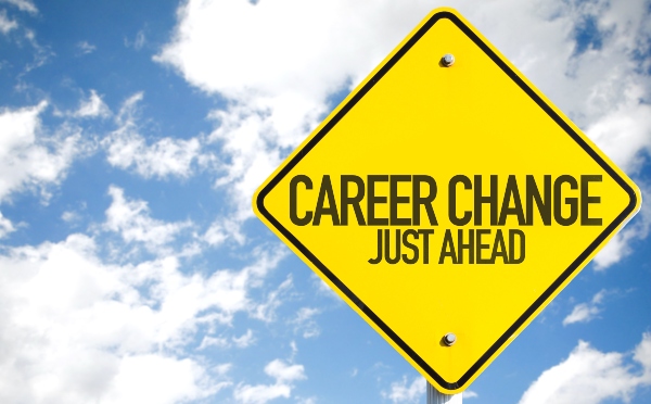 A street sign reads career change just ahead.